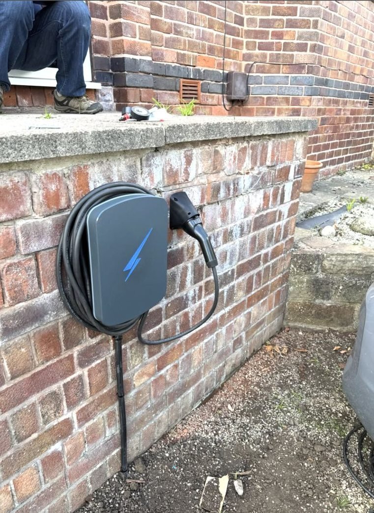 EV charger on a low garden wall